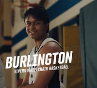 two men standing in a gym with the words burlington vipers wheelchair basketball
