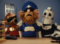 a group of robots sitting at a desk with a calculator